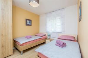 Postel nebo postele na pokoji v ubytování Villa Nika
