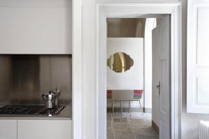 a kitchen with a sink and a stove at Palazzo dei Leoni in Ameno +45 photos