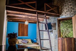 a room with a bunk bed and a ladder at Villa Justen Pousada in Lençóis