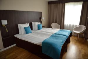 Postel nebo postele na pokoji v ubytování Hotell Nova