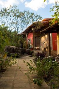 a house with a brick walkway in front of it at Villa Justen Pousada in Lençóis +27 photos