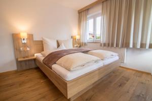 Rúm í herbergi á Haus Reintal