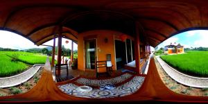 a view of a house from the inside at Guerrera Rice Paddy Villas in Mambajao