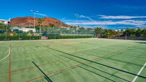 a tennis court with a net on top of it at Hipotels Natura Palace Adults Only in Playa Blanca