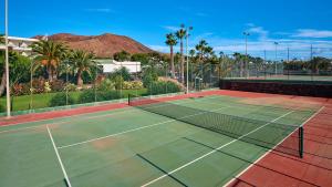 a tennis court with a net on top of it at Hipotels Natura Palace Adults Only in Playa Blanca