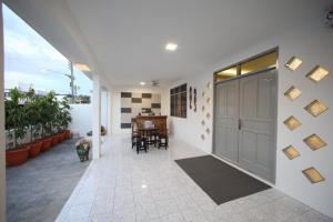 a hallway of a house with a garage at Come Inn Homestay 1379 in Miri