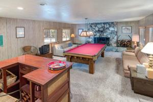 a living room with a pool table in it at 81 Ashbaugh Meadow in North Wawona