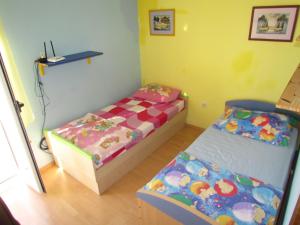 Postel nebo postele na pokoji v ubytování Villa Dario