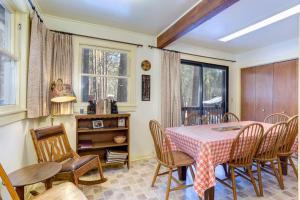 a dining room with a table and chairs at 80 Chattertons Cottage in North Wawona