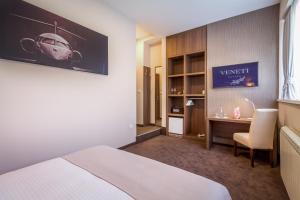 Voodi või voodid majutusasutuse Veneti Suites toas