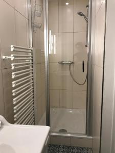 a bathroom with a shower and a sink at Premarental Apartment 1 in Vienna