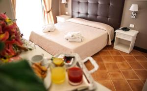 Voodi või voodid majutusasutuse Baia Di Ulisse Wellness & Spa toas