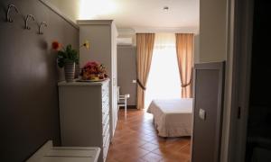 Voodi või voodid majutusasutuse Baia Di Ulisse Wellness & Spa toas