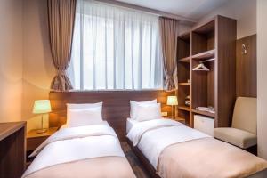 Postel nebo postele na pokoji v ubytování Veneti Suites