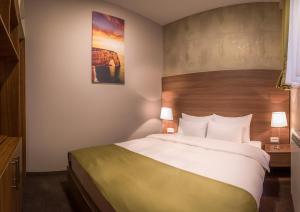 Voodi või voodid majutusasutuse Veneti Suites toas