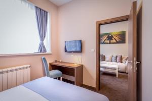 Voodi või voodid majutusasutuse Veneti Suites toas