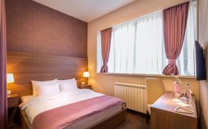 Voodi või voodid majutusasutuse Veneti Suites toas