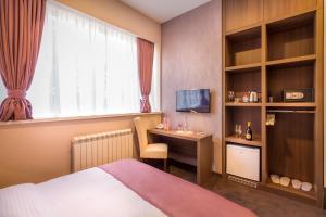 Voodi või voodid majutusasutuse Veneti Suites toas