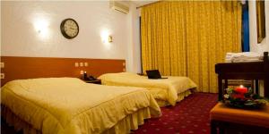 Posteľ alebo postele v izbe v ubytovaní Hotel Oscar + 17 fotografií