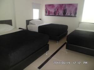 Uma cama ou camas num quarto em Hotel Onix T
