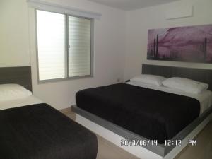 Uma cama ou camas num quarto em Hotel Onix T