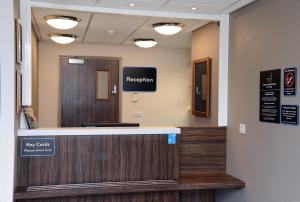 a hospital lobby with a reception desk and a sign at Lock Keeper, Worksop by Marston's Inns in Worksop