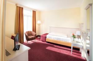 Postel nebo postele na pokoji v ubytování Hotel Seeblick