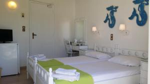 Postel nebo postele na pokoji v ubytování Rachel Hotel