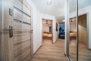 Posteľ alebo postele v izbe v ubytovaní Apartament Bujwida od WroclawApartament-pl