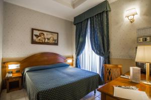 Posteľ alebo postele v izbe v ubytovaní Hotel Verona Rome
