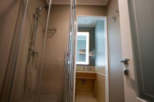 a bathroom with a shower and a sink and a mirror at Room 56 in Bari +33 photos