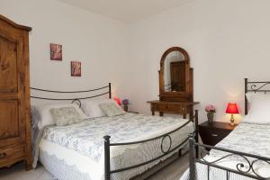 Rúm í herbergi á Borgo Guglielmo