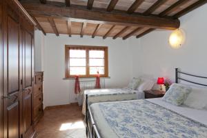 Rúm í herbergi á Borgo Guglielmo