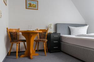 Postel nebo postele na pokoji v ubytování Gasthof 'Zum Reifberg'