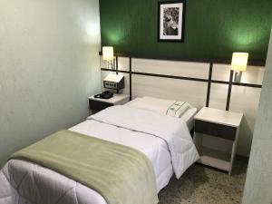 Cama ou camas em um quarto em Residencial Pantanal Santa Cruz mais 8 fotos