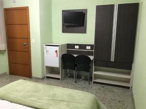 Cama ou camas em um quarto em Residencial Pantanal Santa Cruz