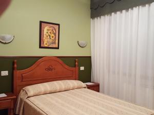 Łóżko lub łóżka w pokoju w obiekcie Hotel La Costera