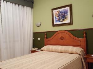 Łóżko lub łóżka w pokoju w obiekcie Hotel La Costera