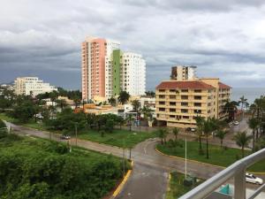 a view of a city with tall buildings at Playa y alberca en Zona Marina in Mazatlán