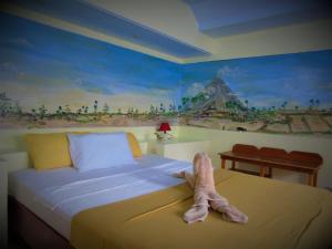 A bed or beds in a room at Phaidon Beach Resort