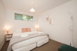 a bedroom with a bed with two towels on it at Robins Nest in Russell