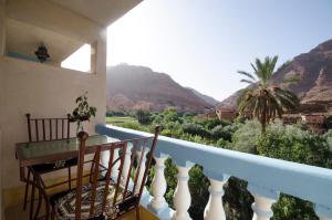 a balcony with a view of the mountains at A Secret Garden in Tinerhir