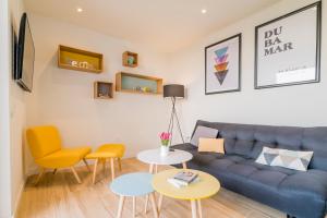 TV a/nebo společenská místnost v ubytování Apartamentos Dubamar
