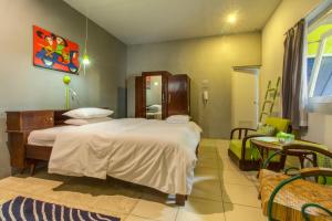 Ένα ή περισσότερα κρεβάτια σε δωμάτιο στο Jeng Tini Guest House