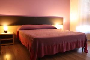Letto o letti in una camera di B&B 5 Sensi
