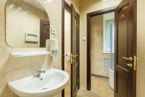 a bathroom with a sink and a mirror at Hostel "Red Moscow" in Moscow