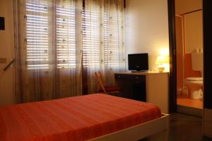 Letto o letti in una camera di B&B 5 Sensi