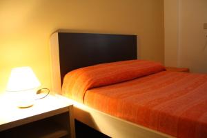 Letto o letti in una camera di B&B 5 Sensi