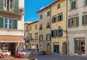 a street in an old town with buildings at Tre Girasoli in Monte San Savino