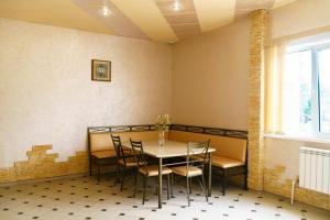 a dining room with a table and chairs at Hotel Complex Park hotel D-grad in Dimitrovgrad